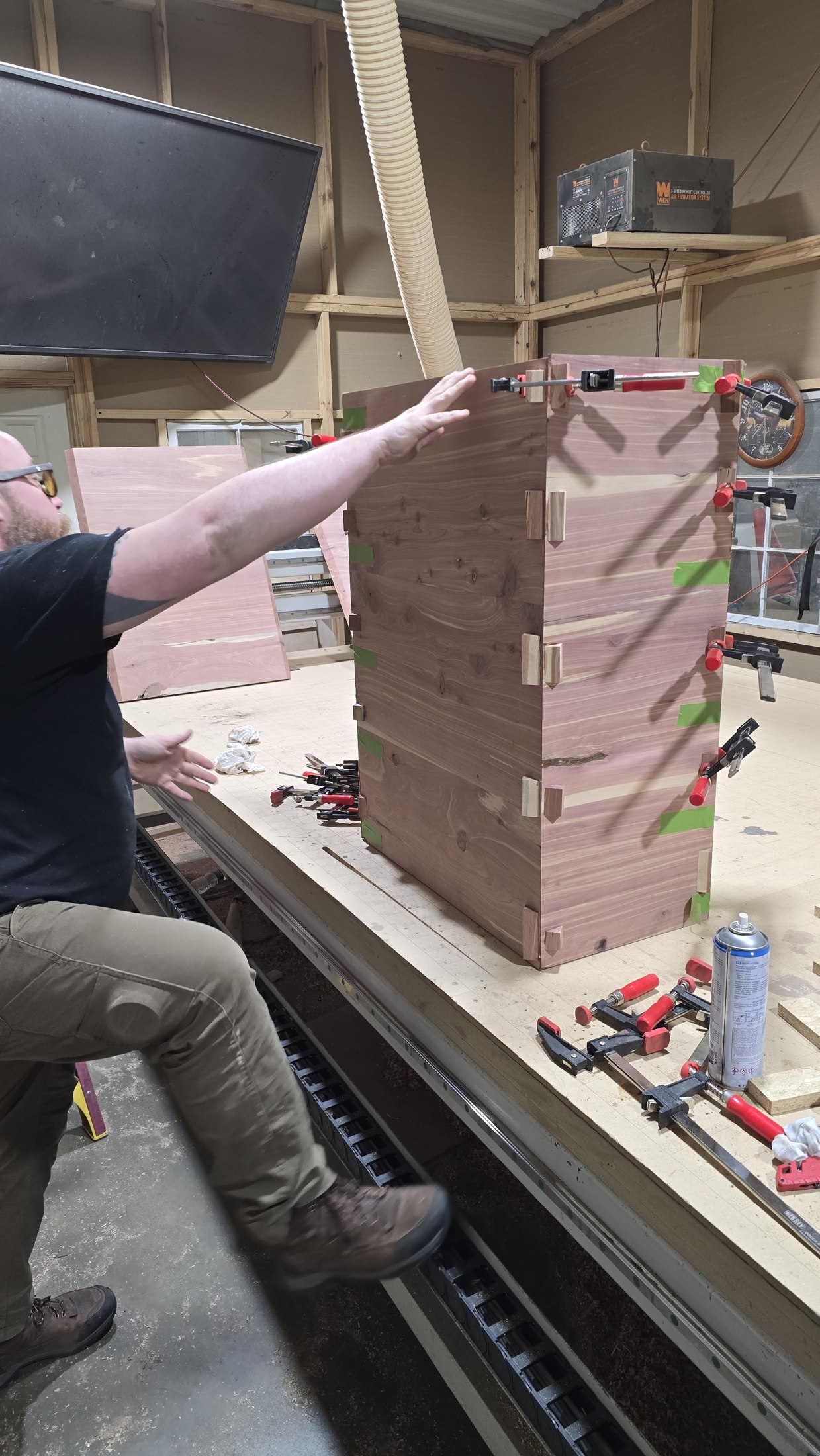 Fitted wooden corner joints on a box being assembled at the workbench.