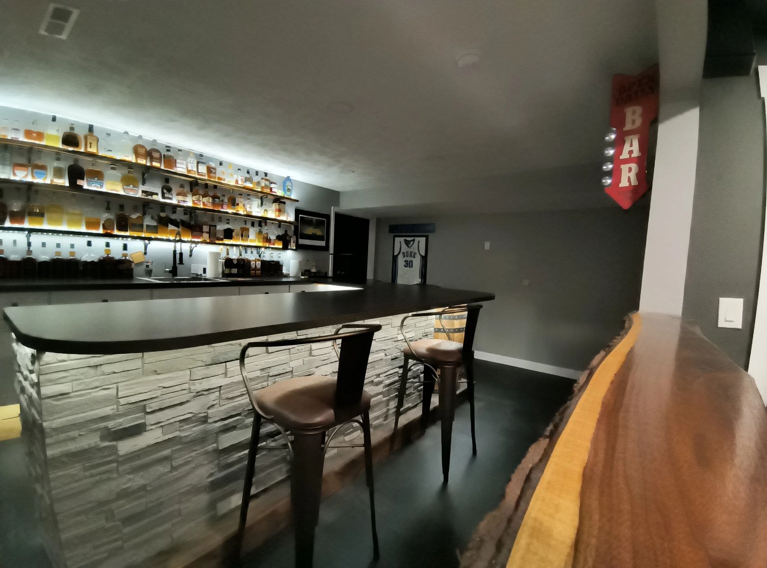 Another view of the Root Family bar, showing the barrel detail and stone-faced front.