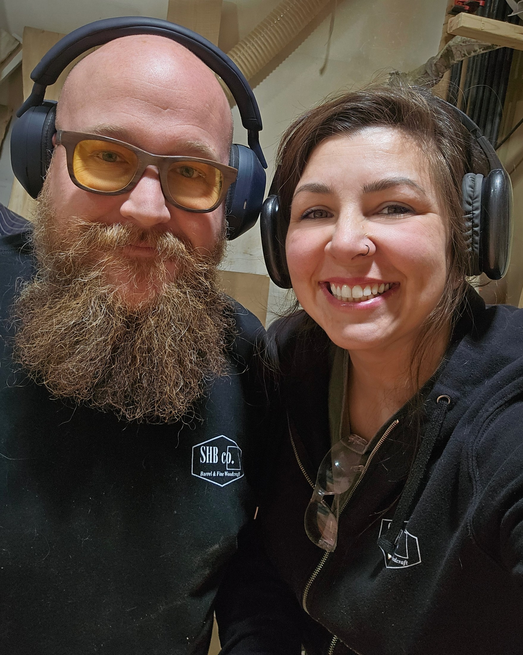 Ryan and Faith together in the workshop wearing hearing protection.
